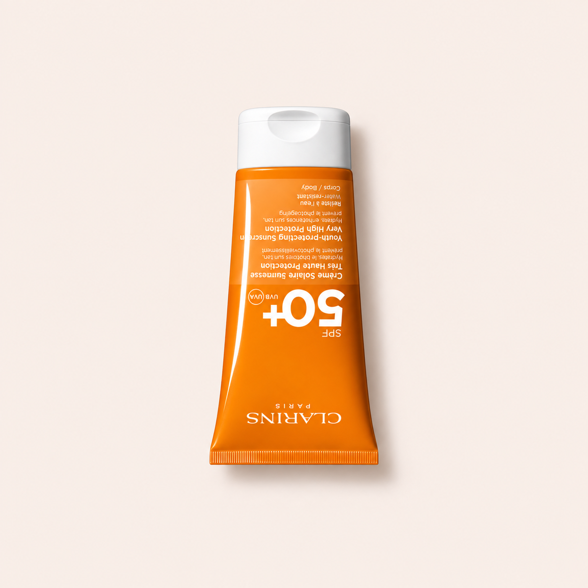 Opalovací přípravek Clarins Sun Care Youth-Protecting Body Sunscreen SPF 50+ 150 ml na béžovém pozadí – MrRizz