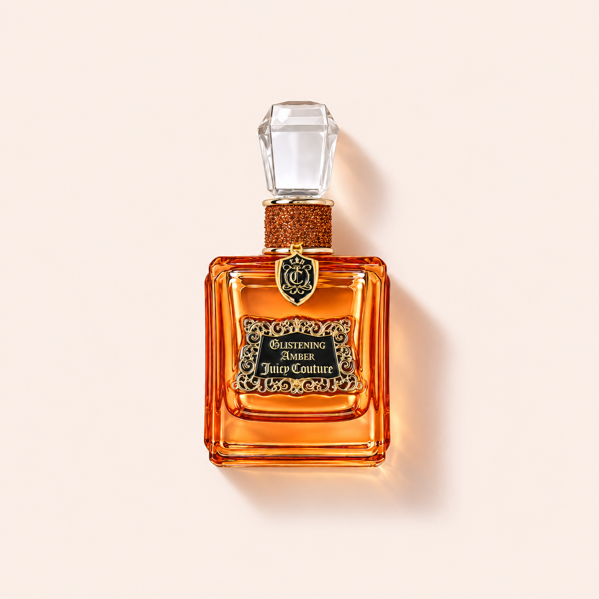 Juicy Couture Glistening Amber EDP 100 ml na béžovém pozadí – MrRizz